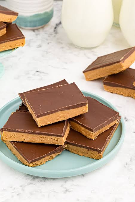 No Bake Peanut Butter Bars stacked on a plate