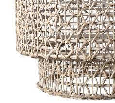 It has a graceful curved back in a natural finish. Open Weave Rattan Tiered Pendant Pottery Barn