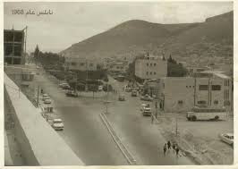 نابلس الباص الواقف على اليمين يقف في أرض المدرسة الغزالية وكانت قد هدمت في 1968 وشارع فيصل ظاهر ف palestine history middle eastern history historical photos
