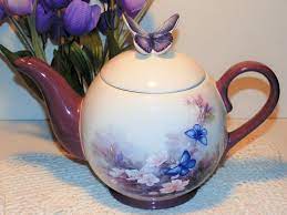 Discover our teawares and tea sets at t2! Vintage Blossoms And Butterflies Teapot By Teleflora Signed Lena Licl Collectible Teapot Purple Flowers Blue Butterflies Cottage Chic Butterfly Teapot Tea Pots Cottage Chic