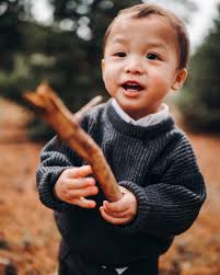 Picking up sticks in the yard with dad