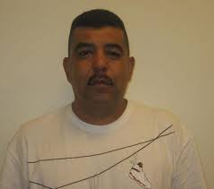 Former jailer accused in drug scheme sues county