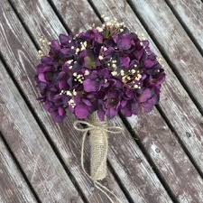 Www.myfloweraffair.com can create this beautiful wedding flower look. Rustic Wedding Purple Hydrangea Bouquet With Touches Of Baby S Breath Silk Flowers Wedding Purple Hydrangea Bouquet Burlap Wedding