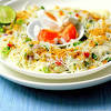 Delicate rice vermicelli salad tossed with a chiffonade of southeast asian herbs, julienned cucumbers, carrots, and ginger flower. 1