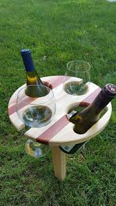 Bistro tables that can allow half dozen people to gather around, a side table, or a full wine barrel on casters that has been turned into a cabinet. 2 Bottle Folding Portable Wine Table Picnic Wine Table Outdoor Wine Table Folding Wine Table Beer Glass Table Wine Table Outdoor Wine Table Folding Wine Table