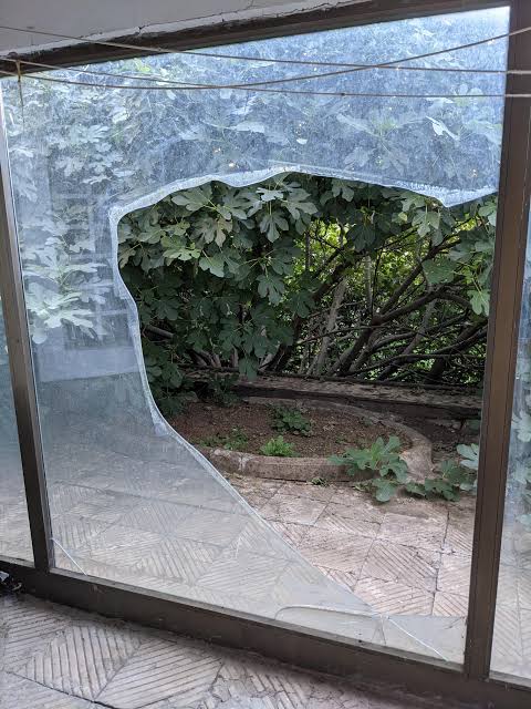 How do I safely break and remove this thick glass? I was thinking of  applying scotch tape to the entire piece and with blankets on both sides to  apply hammer. I am