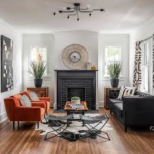 You have been chosen by us out of hundreds of images available. What To Do With An All White Room With A Black Fireplace Obviously We Would Add Color Thanks Living Room Orange Orange Chairs Living Room All White Room