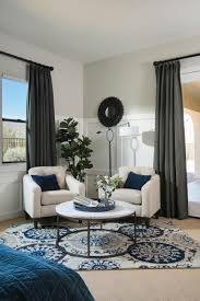 Like in the home above in heritage at kennesaw for example, take a look at the master bedroom above from our model home in maple village. Contemporary Blue And White Master Bedroom Sitting Area With White Chairs And Round Table Hgtv