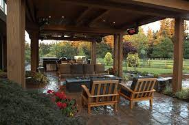 Are you in the market for a well made and uniquely designed fire pit? Gorgeous Covered Stone Patio With Heaters Gas Fire Pit And An Outdoor Kitchen From 1 Of 8 Projects By Alderwood Landsca Patio Design Patio Patio Seating Area