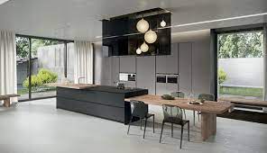 The builder says the island doubles as a laundry folding heart and laptop table. 13 Kitchen Islands With Tables A Simple Smart Combination Mecc Interiors