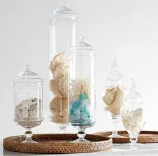 Although the kitchen is the first place you would think to store glass canisters, choosing them as bathroom accessories can refresh outdated bathrooms or add a touch of timeless elegance to any powder room's décor. Coastal Apothecary Jars Glass Jars Storage Canisters For Kitchen Bathroom Coastal Decor Ideas Interior Design Diy Shopping