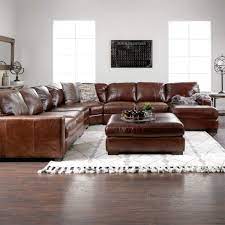 It has held up and maintained its appearance for over 3 years. The Handsome Landmark Brown Leather Living Room Sectional Is Distinguished By I Leather Living Room Furniture Living Room Leather Leather Sectional Living Room