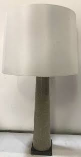 This table lamp has an unusual grey colour cement base with a linen shade in biscuit. Faux Cement Table Lamp Ga Prop Source