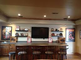 Using the concepts of scale and proportion, the designers were able to accommodate seating for up to 10 people, which was far better than the five they could fit on the old sectional. Baseball Themed Basement Wet Bar Basement Bar Designs Basement Bar Diy Basement Bar Plans