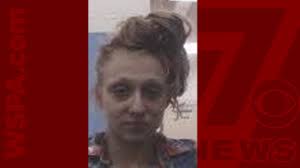 Woman accused of throwing gas