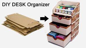 For an indoor scene, glue a magazine cutout of a living room to the back of the box to make it look like a house. How To Make A Stationary Diy Desk Organizer Using Cardboard By Craftinghours Youtube Diy Stationary Desk Organization Diy Diy Cardboard