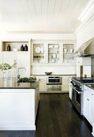 Even in a kitchen with a cottage vision, some rustic flooring with a deeper tone will work well. Kitchen Cabinet Black Kitchen Cabinets Dark Floors Simple Beautiful Kitchen Design