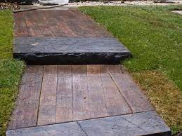 You may be able to manage pouring and placing the concrete with minimal issues, but if you don't get the imprinting process just right, you'll be left with a permanent slab that can be difficult and expensive to repair. Wood Plank Sidewalk Stamped Concrete Patio Stamped Concrete Wood Stamped Concrete