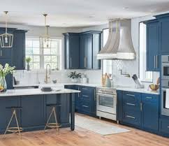 For the best results, you might want to compliment the navy blue cabinets with stark white backsplashes and window treatments. Kitchen Cabinetry