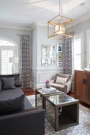 Crafted in india, this aluminum table features a large etched lotus emblem at the center of the round tabletop. Navy Blue Sofa With Wood And Mirror Coffee Tables Transitional Living Room
