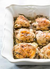 Herb Roasted Chicken Thighs With Potatoes Recipe Simplyrecipes Com Recipe Roasted Chicken Thighs Herb Roasted Chicken Chicken Recipes
