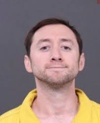 Bucks County DA's Office releases booking photo of Justin Mohn, who is  facing murder charges in the killing of his father. Mohn is accused of not  only beheading his father, Michael F.
