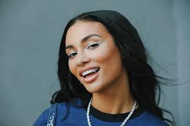 The Story Behind Kristen Noel Crawley's Custom Louis Vuitton Grills