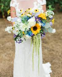Another advantage of sunflowers is that they are relatively inexpensive and you don't need many to make a fabulous display. 20 Sunflower Bouquets That Will Brighten Up Your Wedding Day Sunflower Bridal Bouquet Bridal Sunflowers Sunflower Wedding Bouquet