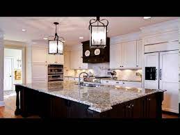 These are durable granite countertops that require minimal maintenance and are heat and scratch resistant. White Kitchen Cabinets With New Venetian Gold Granite Youtube