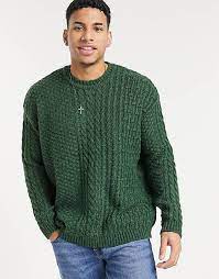 Pick an oversized sweatshirt with a graphic print for a bold statement, or opt for timeless monochrome stripes or cable knits, in camel, navy or gray. Asos Design Oversized Mixed Cable Knit Sweater In Forest Green Asos