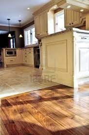 Hardwood And Tile Floor In Residential Home Kitchen And Dining Modern Kitchen Flooring Best Flooring For Kitchen Kitchen Floor Tile Patterns