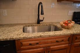 Subway Tile And Neutral Granite Dark Pulls Cherry Cabinets Trendy Kitchen Backsplash Trendy Kitchen Tile Tile Countertops Kitchen