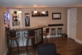 Rob and lauren qualls within their renovated basement sports bar that a little over a year ago was totally flooded with a foot of water. Dsc 0699 Basement Bar Diy Basement Bar Plans Basement Bar Designs