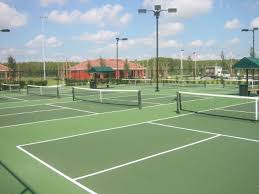 Also, there's something beautiful about playing outdoors when the sun is going down. Tennis Court Builders Tennis Courts Construction Welch Tennis Courts Inc
