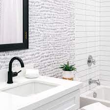 Wallpapered a feature wall in a bathroom. 5 Smart Ways To Use Wallpaper In Your Bathroom