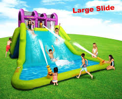 They feature a long plastic slide, and just be warned — the neighbor's kids are going to spend their summers at your house. Huge Water Slide Park For Kids Toddler Inflatable Splash Pool Large Bounce Spray Hugewatersl Water Slides Backyard Backyard Water Parks Inflatable Water Slide