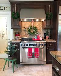 Showing My Kitchen Some Love With Pops Of Red Wreaths Hung With Ribbons And Some Holiday Gr Holiday Kitchen Decor Christmas Kitchen Decor Christmas Kitchen