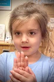 Santa speaks Dutch to a little girl in Macy's