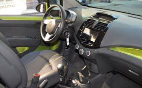 Photo 2013 Chevrolet Spark Interior Front Inside The The Spark Has Decorative Inserts On The Dashboard And Chevrolet Spark Cheap Cars For Sale Chevrolet