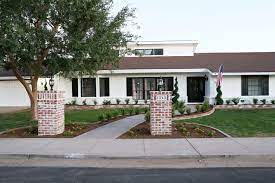Modest red brick house with black shutters. Modern Ranch House Our Black And White Exterior Paint Classy Clutter