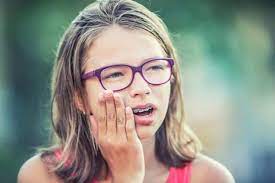 How To Get Rid Of Braces Pain: These 9 Tips Can Help
