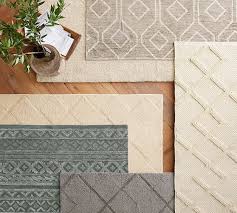 The pile is looped, cut and tufted by hand to produce a softly textured effect that feels inviting with every step. Mae Diamond Tufted Rug Ivory Tufted Rug Rugs Grey Rugs