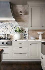 Easy On The Eyes 5 Gray Cream Kitchens And The Perfect Off White Paint Color Transitional Kitchen Design Popular Kitchen Countertops Kitchen Inspirations