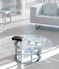 Simple circular shape holds tempered glass tabletop and shelf, crafting a slight shadowbox effect; Naxos Round Glass Coffee Table Shop Online Italy Dream Design