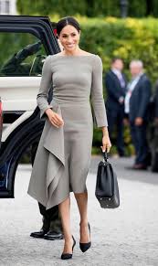Meghan wore a crossbody bag. Meghan Markle Wears 23 000 Worth Of Designer Clothes In 24 Hours While On Royal Visit To Ireland