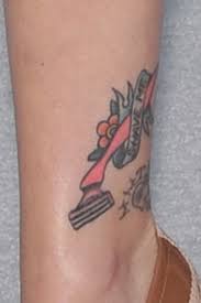 Hayley williams cross thigh tattoo | steal her style. Hayley Williams Pink Razor Ankle Tattoo Steal Her Style