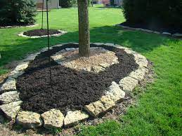 Large rocks are very interesting when they have an asymmetrical shape. Flat Rock Wall Stone Garden Wall Indianapolis Landscaping