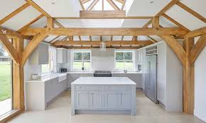 Today's shaker style this shaker kitchen in cherry wood features a furniture style island with table legs and a prep sink shaker kitchen countertops: French Grey Shaker Kitchen Chidingfold Kitchens