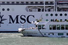 A tourist boat is pictured after it was hit early on june 2, 2019 by the msc opera cruise ship that lost control as it was coming in to dock in venice, italy. Cruise Ship Crashes Into Dock And Tourist Boat In Crowded Venice Canal Skift
