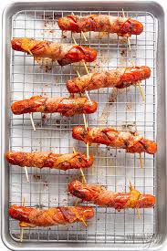 More recently, the unforeseen events of 2020 taught us that even when the world slows down, we still need the convenience of a reli. Bacon Wrapped Hot Dogs In The Oven Wholesome Yum